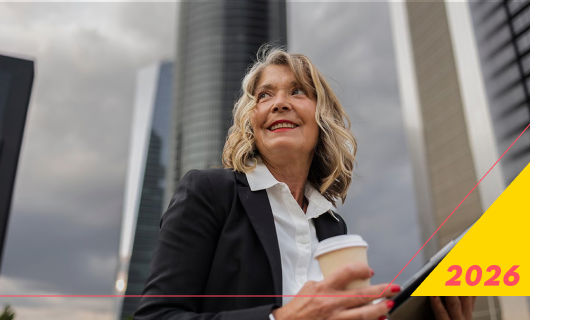 Businesswoman holding coffee in urban setting